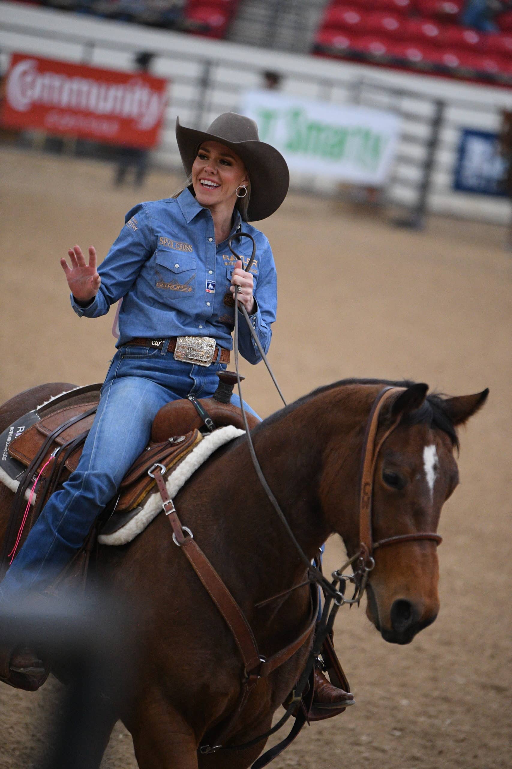 Cadee Williams smiles and waves at her daughter after clinching the NFBR breakaway roping aggregate championship in Las Vegas.