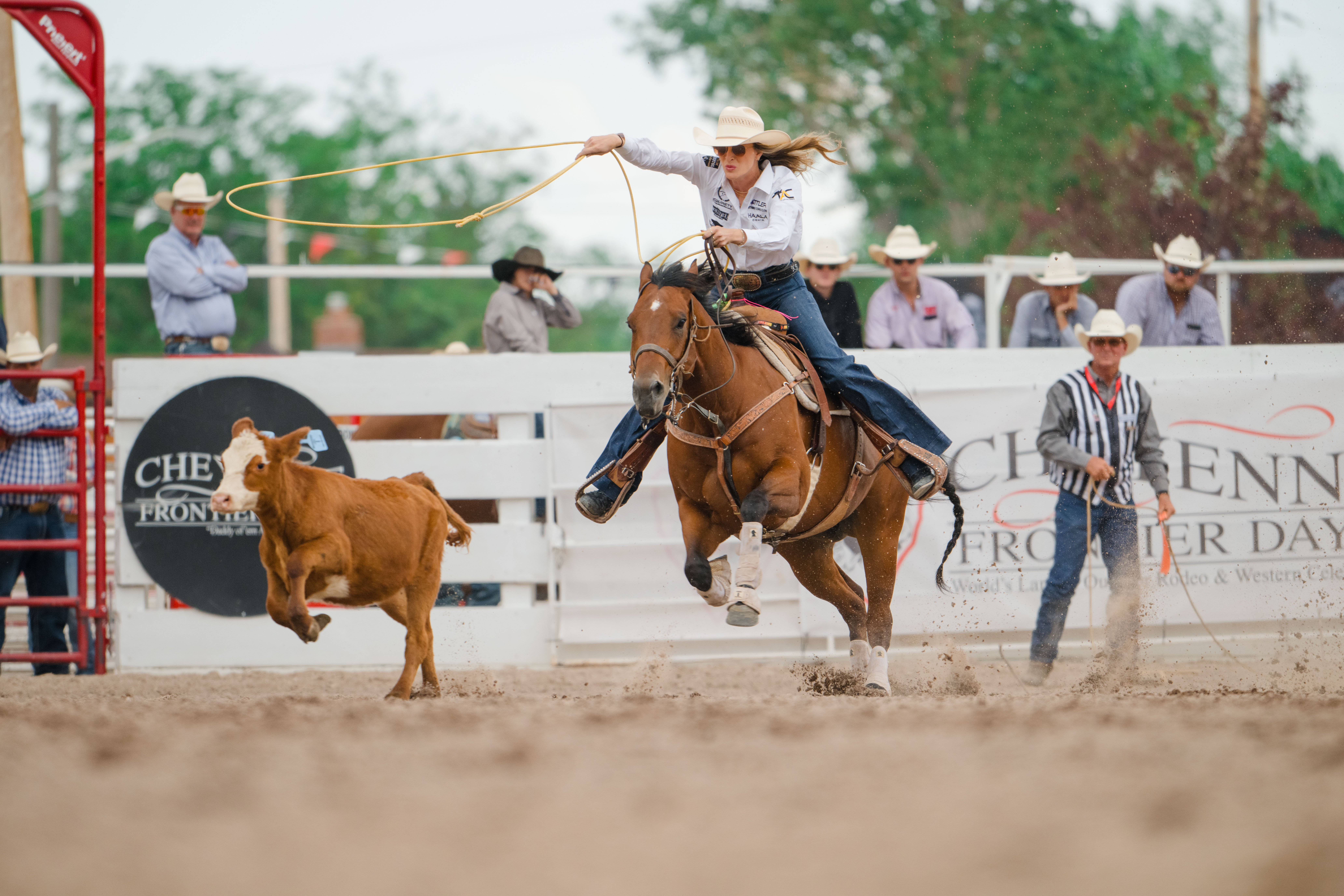 Kinlie Brennise and "Rio" chase one down at Cheyenne Frontier Days.